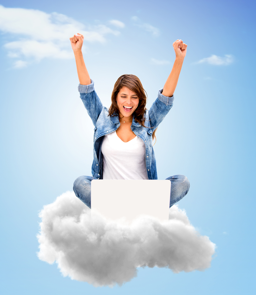 Successful woman using cloud computing with her laptop